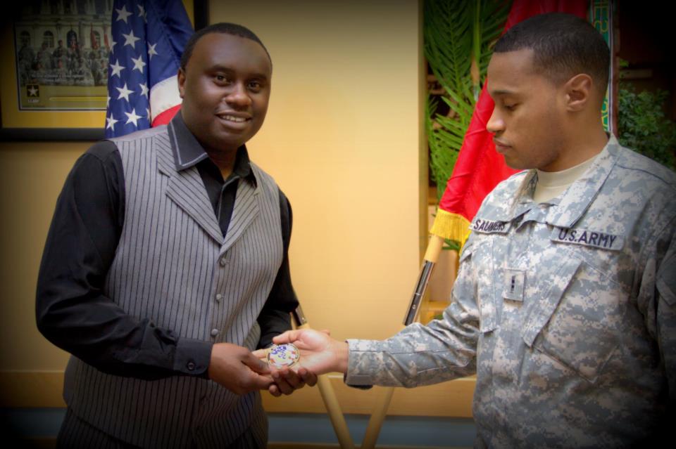 Davies Chirwa receiving the "Operation Iraq Freedom" honorary coin from the U.S Troops.